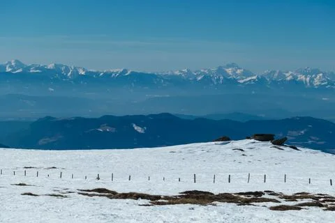 Panoramic view on summit cross of mountain peak Grosser Sauofen in winter o.. Stock Photos