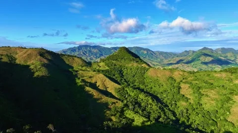 Panoramic view of a sun-drenched mountain range. Видео 330989449