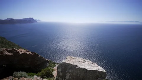 A panoramic view of the sunlit ocean from Cape Point. Stock Footage 209242242
