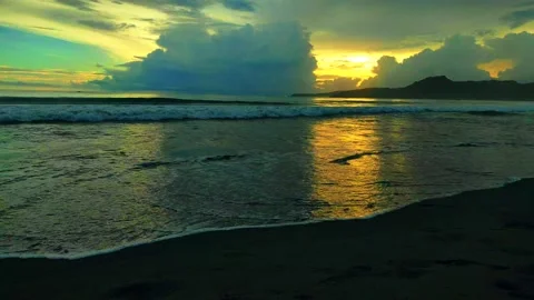 Panoramic view of the sunset on the beach in the evening Stock Footage 233757943