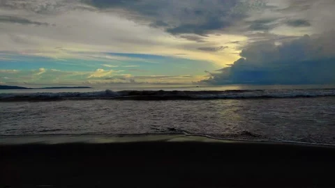 Panoramic view of the sunset on the beach in the evening Stock Footage 233757946