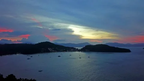 Panoramic View of Sunset over Tropical Islands and Calm Bay Stock-Footage 310380229