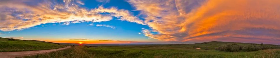Panoramic view of sunset at Reesor Ranch, near Cypress Hills, Alberta, Canda. Stock Photos