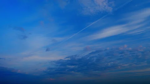 Panoramic view. Sunset sky with condensation trail. Dramatic warm near and far Stock Footage 219283988