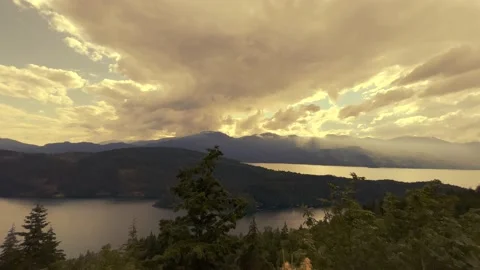 Panoramic view of a sunset sky over the Harrison Lake Stock Footage 201641647