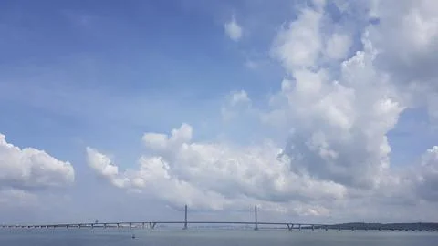 Panoramic view of the Suramadu bridge over the sea with clouds. Stock Photos