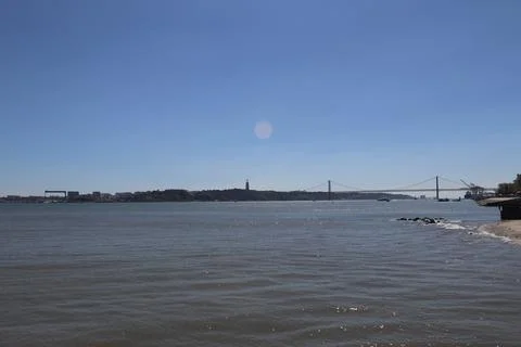 Panoramic view of the Tagus River with the 25 de Abril Bridge and Cristo Rei Stock Photos