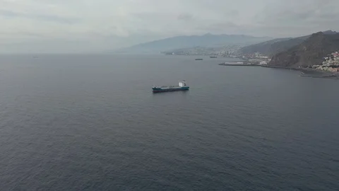 Panoramic view tank vessel sails on ocean by mountains Stock Footage 101965590