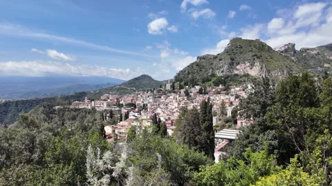 Panoramic view of Taormina with Mount Etna in the background, Sicily, Italy Stock Footage 310858528