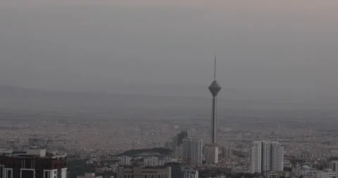 Panoramic view of Tehran with Milad Tower rising above the dense urban skyline Stock Footage 317811634