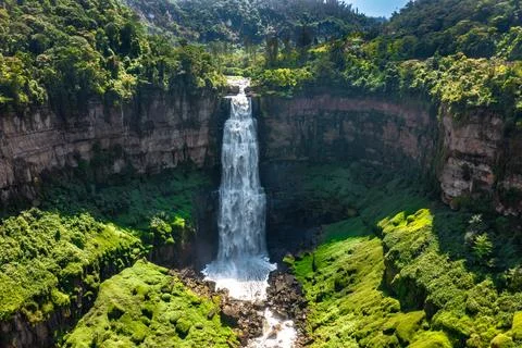 Panoramic view of Tequendama Falls waterfall plunging into vast green canyon Stock Photos