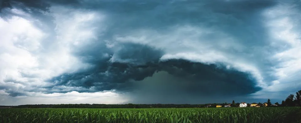 Panoramic view of a terrifying dark thunderstorm approaching Stock Photos