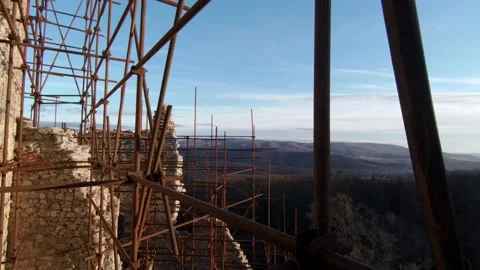 Panoramic view through scaffolding of restored Hrusov castle, eastern part. Stock Footage 146303414