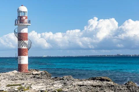 Panoramic view of tip cancun lighthouse on top of the Caribbean sea cliff. Stock Photos