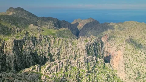 Panoramic view of top edges of rocky mountains on a sunny day in Majorca, Spain. Stock Footage 197487854
