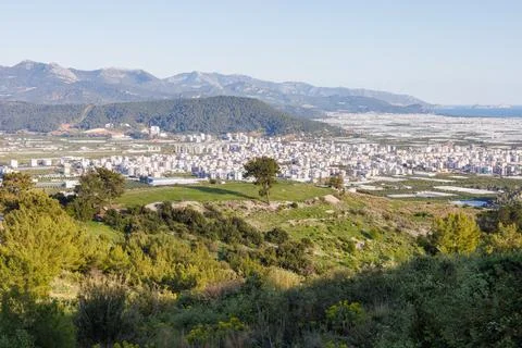 Panoramic view of a town in a valley surrounded by mountain range Stock Photos
