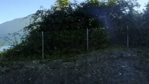 Panoramic View From a Train over Lake Zug and Landscape with Tree and House and Stock Footage 318254562