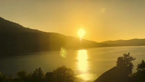 Panoramic View From a Train over Lake Zug and Landscape with Tree and House and Stock Footage 334347469