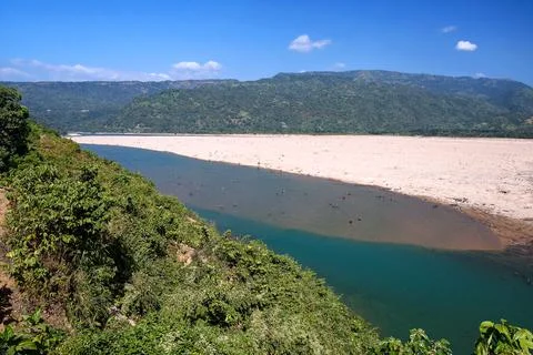 Panoramic View of a Tranquil River and Sandy Riverbed in a Mountain Valley Stock Photos