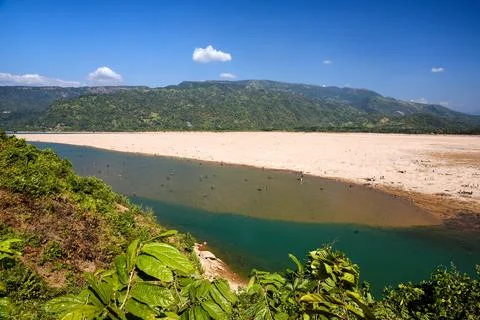 Panoramic View of a Tranquil River and Sandy Riverbed in a Mountain Valley Stock Photos