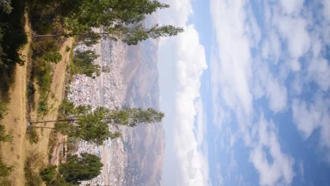 Panoramic view of trees, city and mountains Stock Footage 293094766