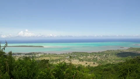 Panoramic View of a Tropical Lagoon with Shifting Shades of Turquoise and Blue Stock Footage 318965459