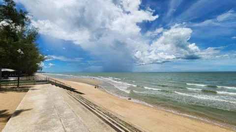 Panoramic View of Tropical Sandy Beach with Dramatic Clouds and Blue Sky Stock Photos