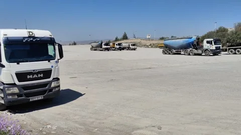 Panoramic View of Truck Queue at Lafarge Cement Plant Entrance, Algeria, 4K 動画素材 331449046