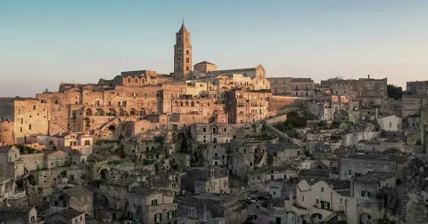 Panoramic view of typical stones and church of Matera under sunset sky Video stock 58636703