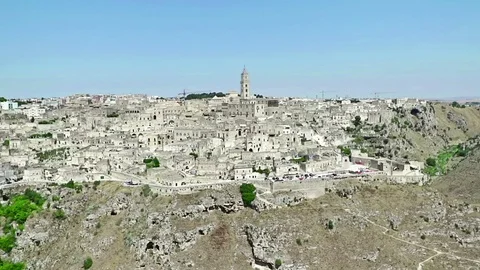 Panoramic view of typical stones Sassi di Matera and church of Matera under sky Stock Footage 77335222