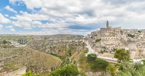 Panoramic view of typical stones (Sassi di Matera) and church of Matera UNESCO Stock Footage 94379669