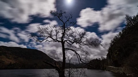 A panoramic view of Ullswater on a moonlit night as the clouds roll in. Stock Footage 265511664