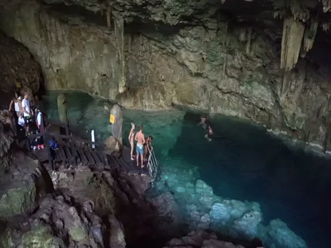 Panoramic view to the underground cave and lake with blue water Stock Footage 71540163