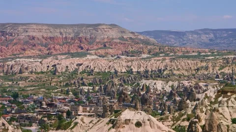 Panoramic view of the unique rock formations and town of Göreme, Cappadocia, Tur Stock Footage 332522738