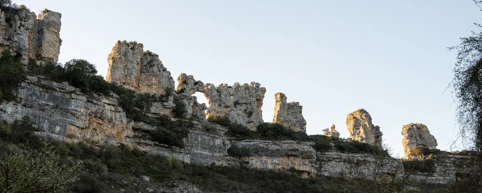 Panoramic view of unique rocky cliffs from Cascada de Orbaneja Stock Photos