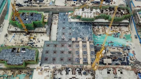 Panoramic View of Urban Development and Tower Cranes Stock Footage 304314075
