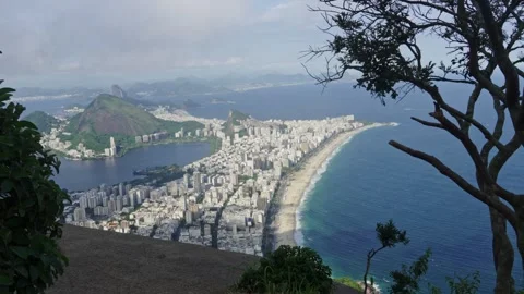 Panoramic view of urban landscape, beach, and ocean from high vantage point 스톡 동영상 334871667