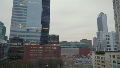 A panoramic view of an urban skyline showcasing modern architecture beneath an 스톡 동영상 295077098