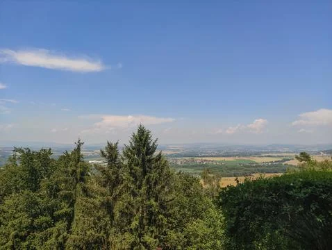 A panoramic view of a valley from a forest on a clear summer day Stock Photos