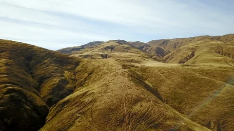 Panoramic view of valley with mountain background, cloudy day, sun-flares Stock Footage 89858680