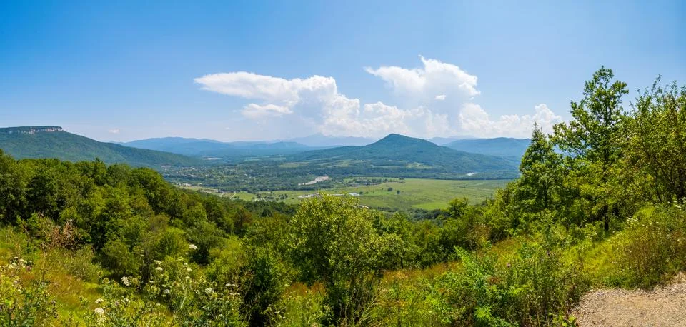 Panoramic view on valley in mountains 스톡 사진