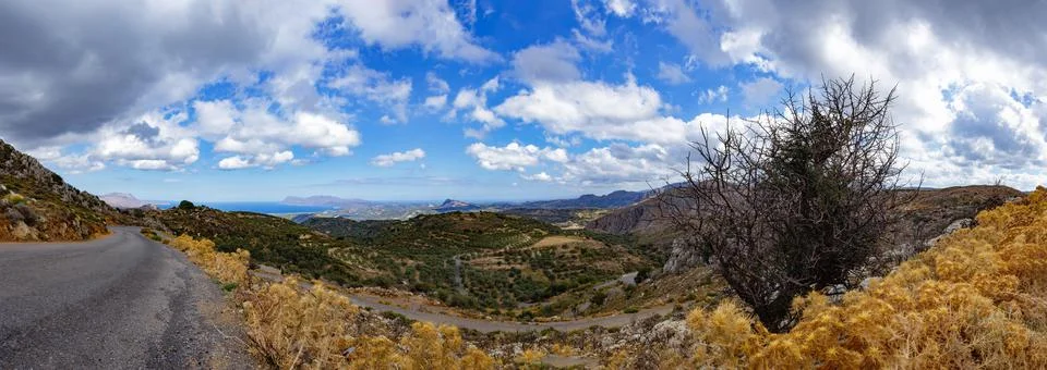 Panoramic view of the valley of olive fields with beautiful clouds, Crete Stock Photos