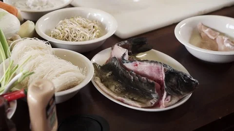 Panoramic view of vegetables and fish on a kitchen table professional chef Stock Footage 73210573