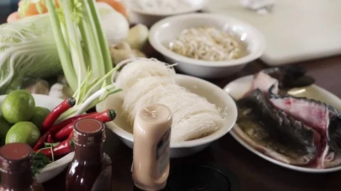 Panoramic view of vegetables and fish on a kitchen table professional chef Stock Footage 73210617