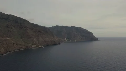 Panoramic view volcanic mountains with white city at ocean Stock Footage 101965278