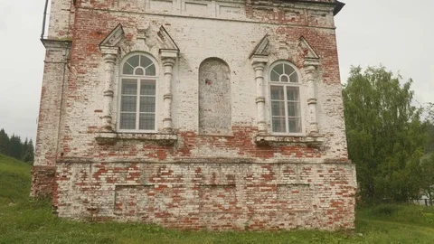 Panoramic view of wall of old church in Ural village. Wall made of red bricks. Stock Footage 122363253