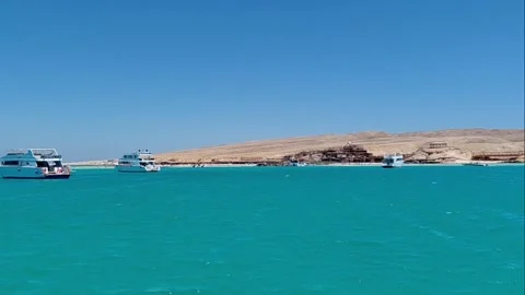 Panoramic view of white yachts anchored near Orange Bay island in Egypt Stock Footage 341353908