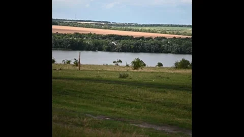 Panoramic View of Wide River with Green Banks and Fields Stock Footage 332218367