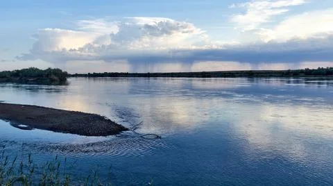 Panoramic view of wide steppe river with a calm current Stock Photos
