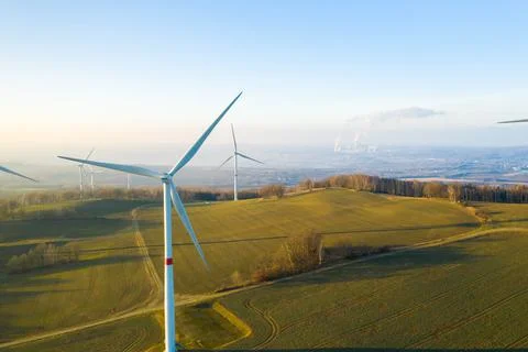 Panoramic view of wind farm or wind park, with high wind turbines for generation Stock Photos